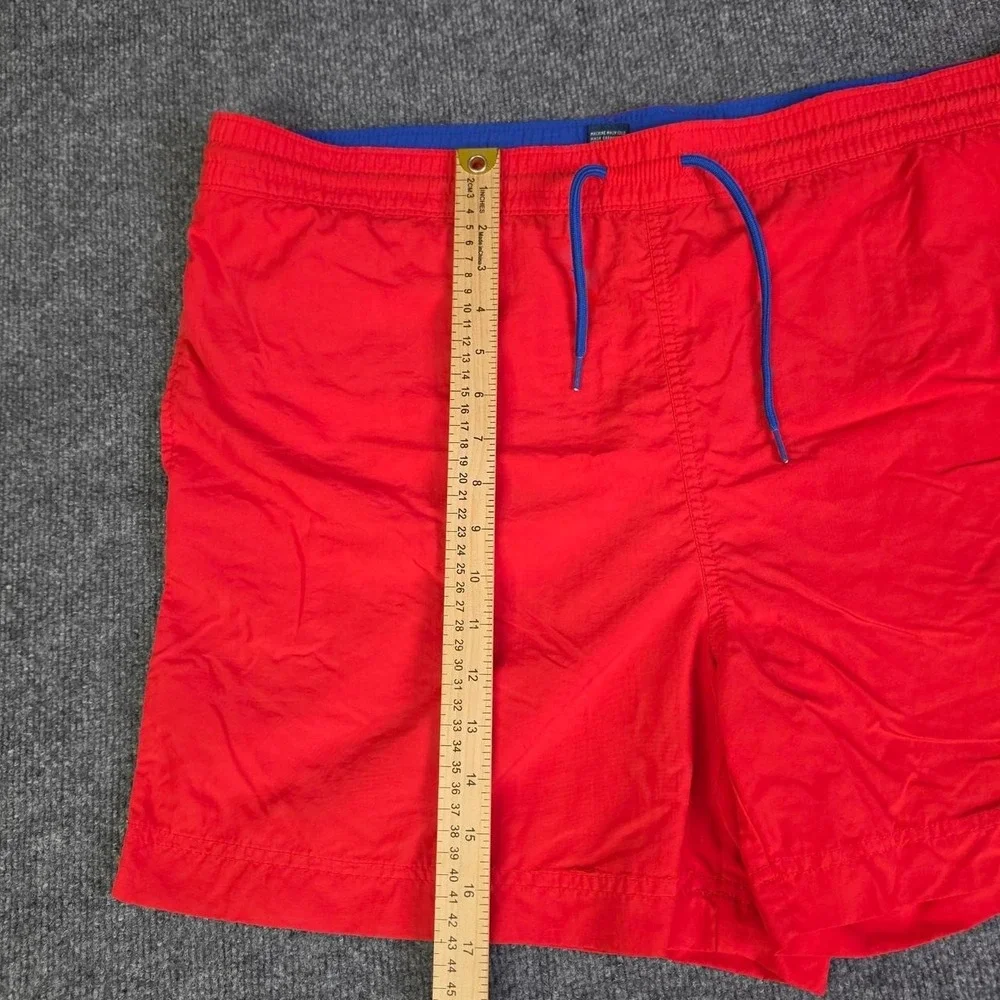 Polo Ralph Lauren orange swim shorts with blue drawstrings. Size XL.